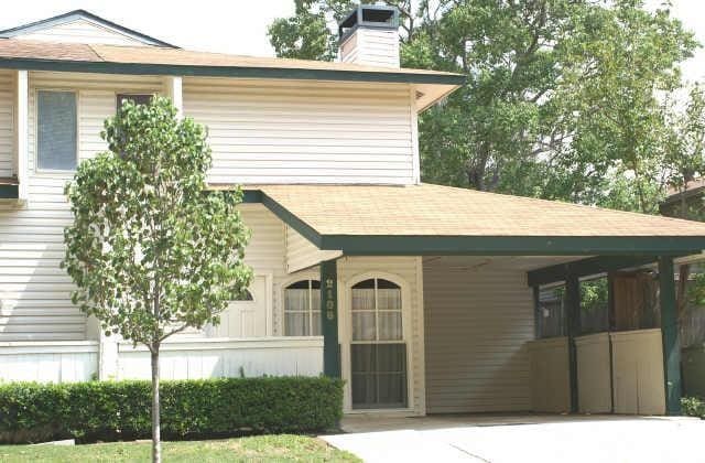 2108 Via Balboa, Carrollton, TX 75006 - view of front of house with a chimney and a shingled roof