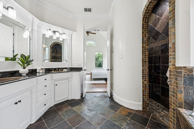 8012 Rushing Spring Dr, North Richland Hills, TX 76182 - bathroom with double vanity, ensuite bath, stone tile flooring, a walk in shower, and crown molding
