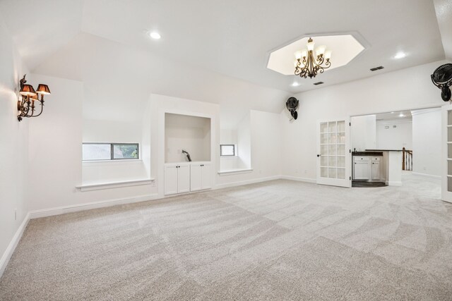 8012 Rushing Spring Dr, North Richland Hills, TX 76182 - unfurnished living room with vaulted ceiling, light colored carpet, recessed lighting, a chandelier, and built in shelves