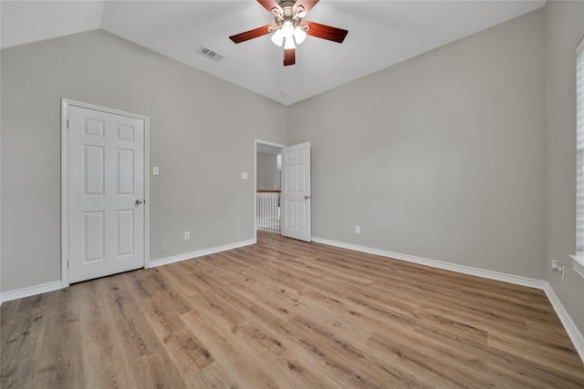 6814 Galway Dr, Garland, TX 75044 - unfurnished bedroom featuring light wood-style flooring, lofted ceiling, and a ceiling fan