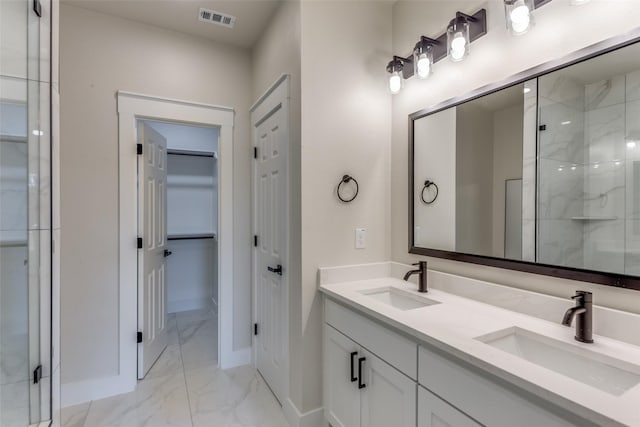 5223 Fletcher Ave, Fort Worth, TX 76107 - bathroom with marble look tile flooring, a stall shower, double vanity, and a closet