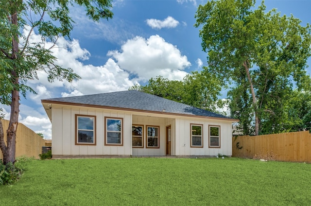 5223 Fletcher Ave, Fort Worth, TX 76107 - back of property with roof with shingles, a fenced backyard, and board and batten siding