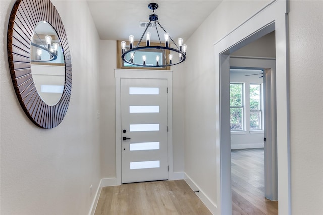 5223 Fletcher Ave, Fort Worth, TX 76107 - foyer entrance featuring a chandelier and light wood-style floors
