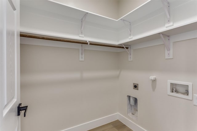 5223 Fletcher Ave, Fort Worth, TX 76107 - laundry area featuring electric dryer hookup, hookup for a washing machine, and wood finished floors