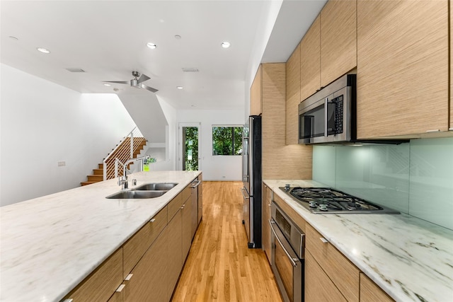 1505 N Haskell Ave Unit 5, Dallas, TX 75204 - kitchen with appliances with stainless steel finishes, light wood-style flooring, recessed lighting, light stone countertops, and decorative backsplash