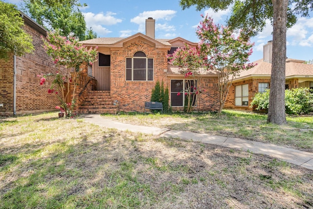 1740 Alameda Dr, Mesquite, TX 75150 - view of front facade with a chimney and brick siding