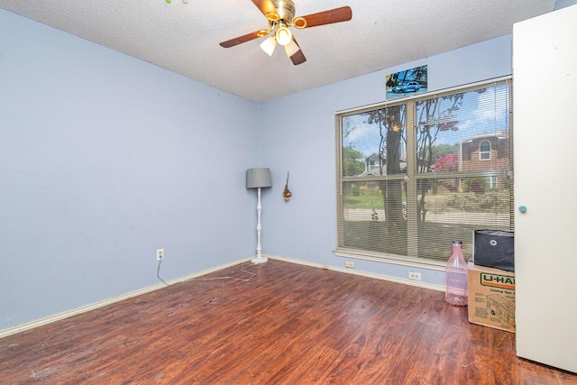 1740 Alameda Dr, Mesquite, TX 75150 - empty room featuring wood finished floors, a ceiling fan, and a textured ceiling