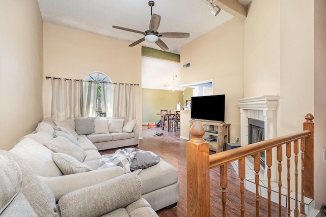 1740 Alameda Dr, Mesquite, TX 75150 - living room with a ceiling fan, wood finished floors, high vaulted ceiling, and a fireplace
