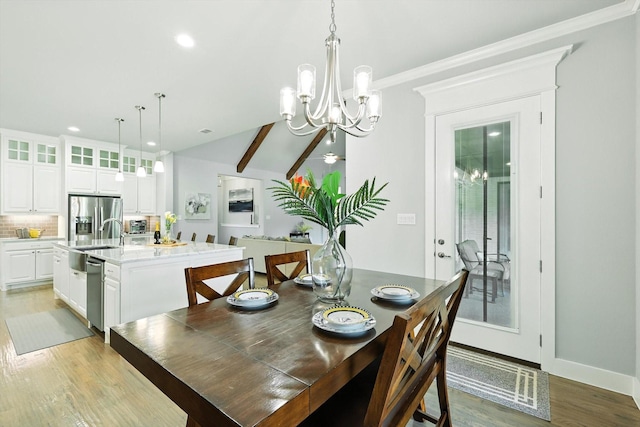 2941 American Sparrow Dr, Midlothian, TX 76065 - dining area with a chandelier, recessed lighting, light wood finished floors, crown molding, and lofted ceiling