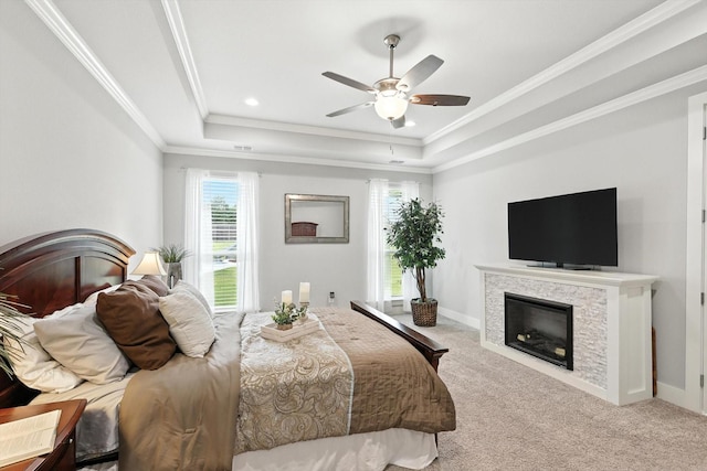 2941 American Sparrow Dr, Midlothian, TX 76065 - carpeted bedroom featuring a fireplace, a raised ceiling, crown molding, ceiling fan, and recessed lighting