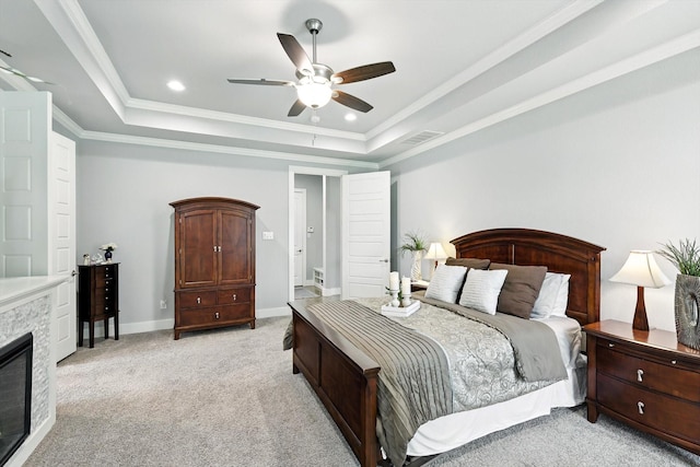 2941 American Sparrow Dr, Midlothian, TX 76065 - bedroom featuring a raised ceiling, light carpet, a stone fireplace, crown molding, and ceiling fan