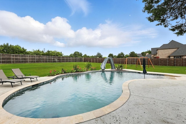 2941 American Sparrow Dr, Midlothian, TX 76065 - view of swimming pool with a water slide, a fenced backyard, a patio area, and a playground