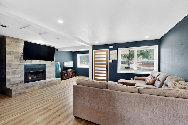 2549 Vickie St, Mesquite, TX 75149 - living room featuring wood finished floors, a fireplace, and recessed lighting