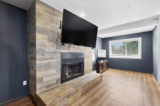 2549 Vickie St, Mesquite, TX 75149 - living room with light wood finished floors and a tile fireplace