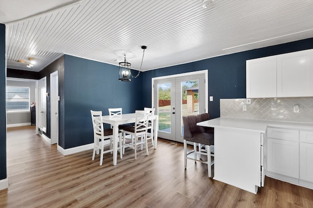 2549 Vickie St, Mesquite, TX 75149 - dining room featuring french doors, light wood-style floors, and wood ceiling