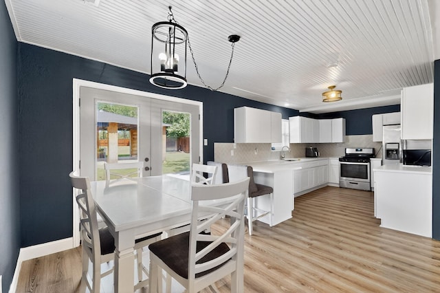 2549 Vickie St, Mesquite, TX 75149 - dining space featuring healthy amount of natural light, french doors, and light wood finished floors