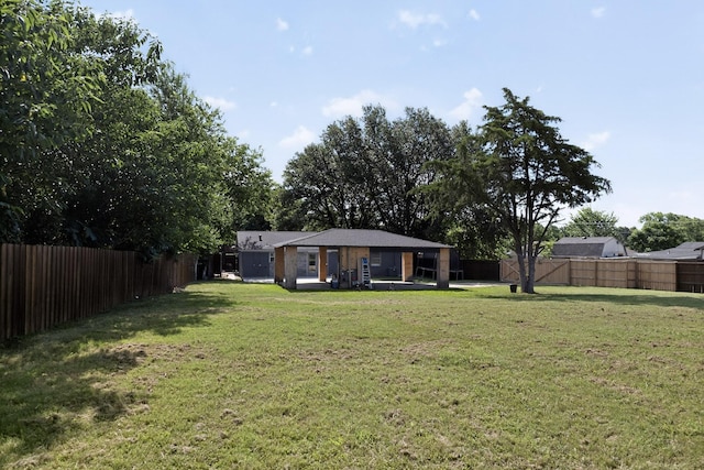 2549 Vickie St, Mesquite, TX 75149 - fenced backyard with a patio area
