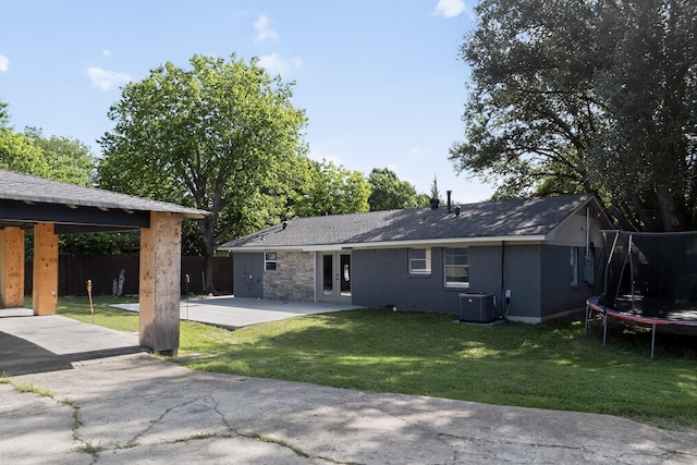 2549 Vickie St, Mesquite, TX 75149 - back of house with a trampoline, french doors, and a patio area