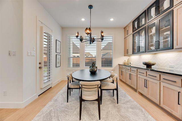 2217 Grey September St, Celina, TX 75009 - dining room with light wood-style floors, a chandelier, and recessed lighting