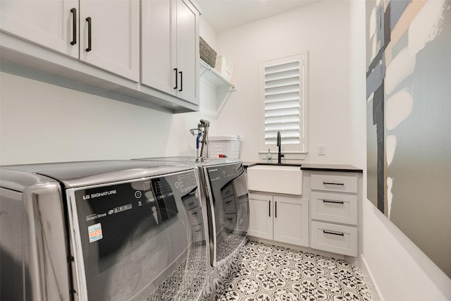 2217 Grey September St, Celina, TX 75009 - laundry area with washing machine and clothes dryer, cabinet space, and light tile patterned floors