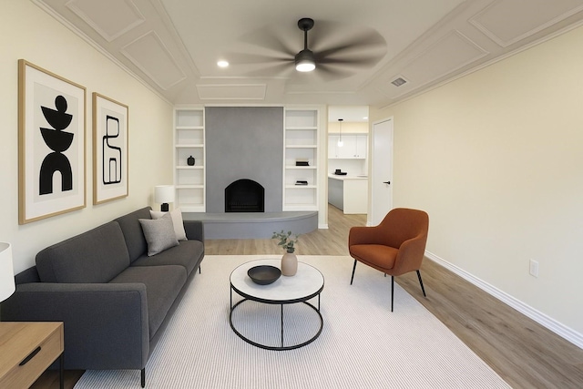 2524 Bear Haven Dr, Grapevine, TX 76051 - living room featuring light wood-style floors, a fireplace, built in features, and ceiling fan