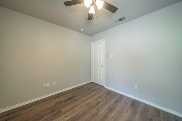 1405 Scotland Ave, Azle, TX 76020 - unfurnished room with dark wood-style floors and a ceiling fan