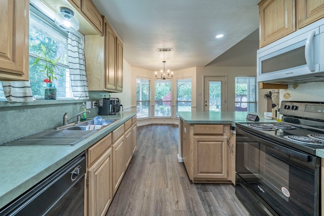1405 Scotland Ave, Azle, TX 76020 - kitchen featuring black appliances, wood finished floors, a chandelier, light brown cabinets, and light countertops