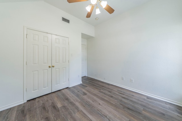 1405 Scotland Ave, Azle, TX 76020 - unfurnished bedroom with wood finished floors, a closet, ceiling fan, and lofted ceiling