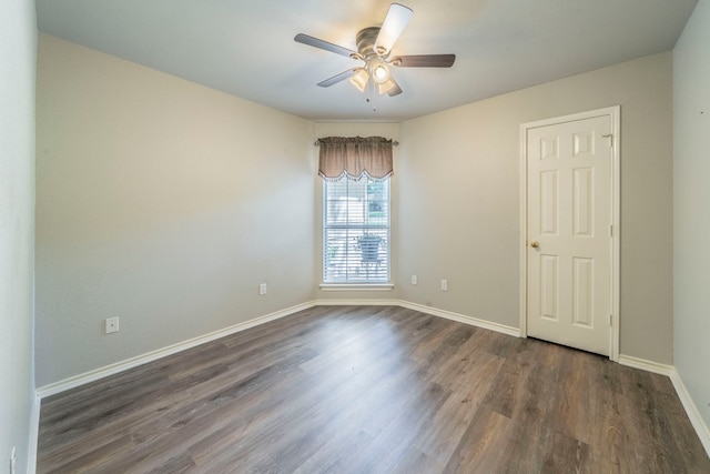 1405 Scotland Ave, Azle, TX 76020 - spare room featuring a ceiling fan and dark wood-type flooring