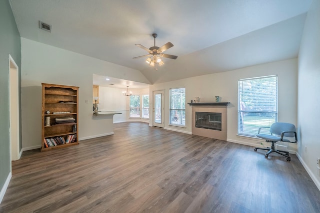 1405 Scotland Ave, Azle, TX 76020 - unfurnished living room with dark wood-type flooring, a ceiling fan, a tile fireplace, a chandelier, and vaulted ceiling