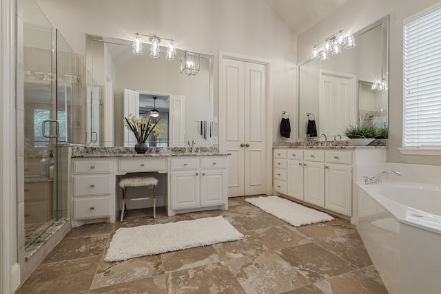 504 Rainforest Ln, Allen, TX 75013 - full bathroom with a garden tub, two vanities, a shower stall, and high vaulted ceiling