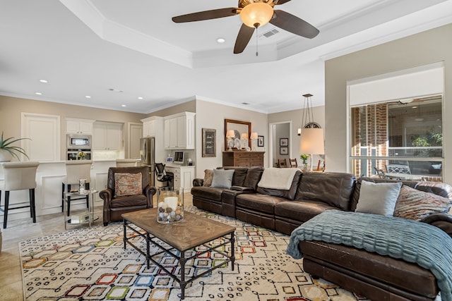 504 Rainforest Ln, Allen, TX 75013 - living area with a raised ceiling, a ceiling fan, crown molding, and recessed lighting