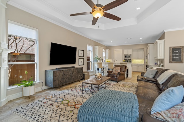 504 Rainforest Ln, Allen, TX 75013 - living room with ceiling fan, recessed lighting, ornamental molding, and a raised ceiling
