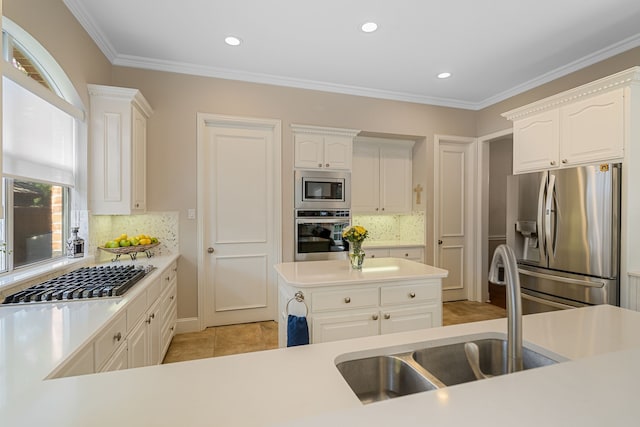 504 Rainforest Ln, Allen, TX 75013 - kitchen featuring appliances with stainless steel finishes, tasteful backsplash, white cabinets, light countertops, and recessed lighting