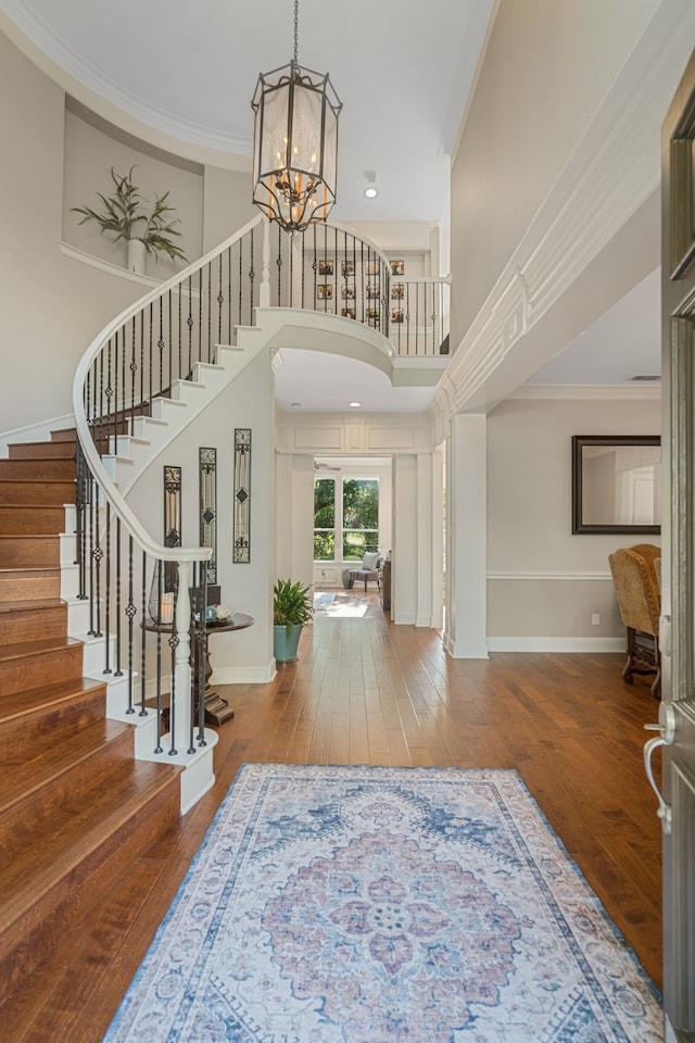 504 Rainforest Ln, Allen, TX 75013 - foyer with stairs, hardwood / wood-style flooring, a chandelier, crown molding, and a towering ceiling