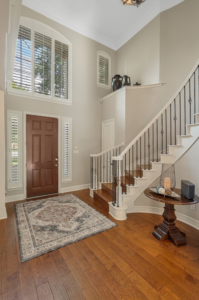 504 Rainforest Ln, Allen, TX 75013 - entrance foyer featuring a towering ceiling, wood-type flooring, stairway, and crown molding