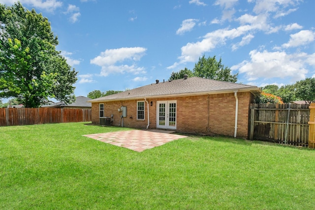 7300 Windhaven Rd, North Richland Hills, TX 76182 - back of property featuring french doors, a fenced backyard, a patio area, and brick siding
