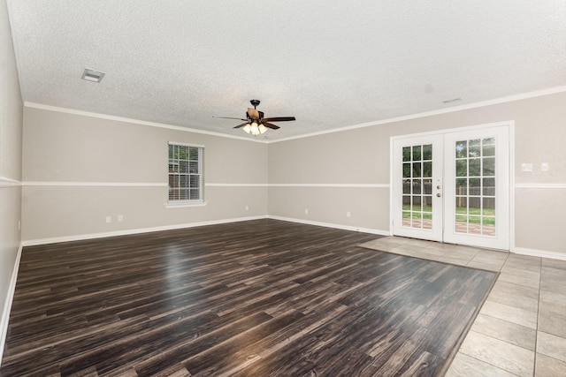 7300 Windhaven Rd, North Richland Hills, TX 76182 - empty room with wood finished floors, french doors, a ceiling fan, a textured ceiling, and crown molding