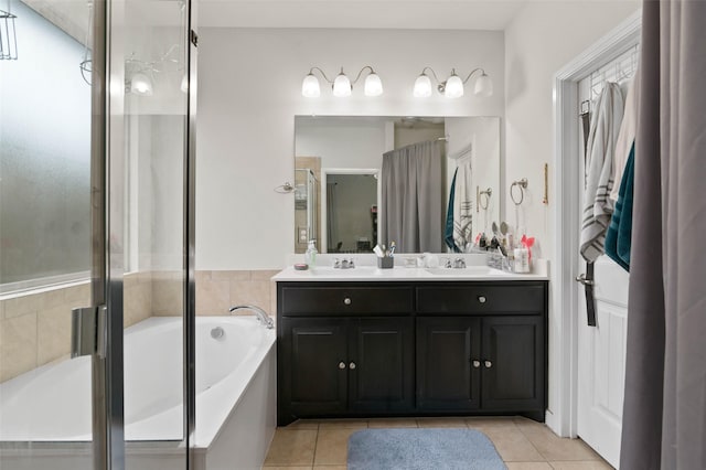 320 Grassland Dr, Denton, TX 76210 - full bath featuring tile patterned flooring, a garden tub, double vanity, and a shower with shower door