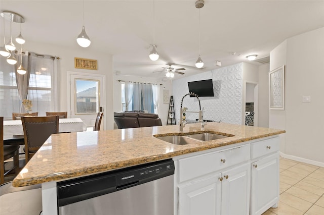 320 Grassland Dr, Denton, TX 76210 - kitchen with stainless steel dishwasher, open floor plan, a center island with sink, light tile patterned floors, and white cabinetry