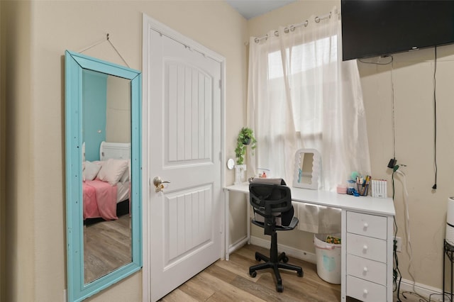 320 Grassland Dr, Denton, TX 76210 - office area with light wood-style flooring and baseboards