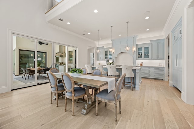 2009 Wheeler Dr, Southlake, TX 76092 - dining space with light wood-style flooring, recessed lighting, and ornamental molding