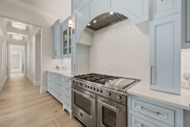 2009 Wheeler Dr, Southlake, TX 76092 - kitchen with double oven range, light countertops, light wood-style flooring, glass insert cabinets, and ornamental molding