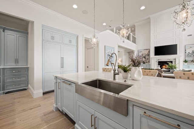 2009 Wheeler Dr, Southlake, TX 76092 - kitchen with a chandelier, light stone countertops, light wood-type flooring, recessed lighting, and decorative light fixtures
