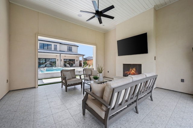 2009 Wheeler Dr, Southlake, TX 76092 - living room with a warm lit fireplace, ornamental molding, ceiling fan, light floors, and a high ceiling