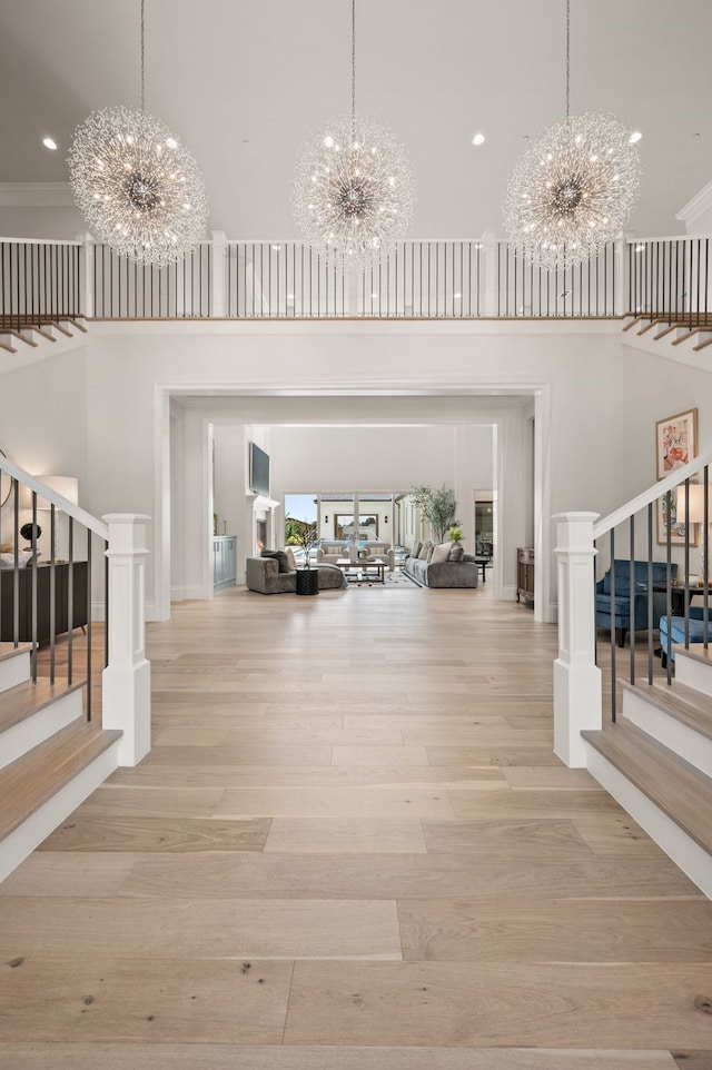 2009 Wheeler Dr, Southlake, TX 76092 - entryway featuring a chandelier, stairs, a towering ceiling, wood finished floors, and recessed lighting