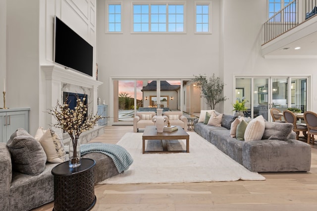 2009 Wheeler Dr, Southlake, TX 76092 - living room with a high ceiling, a fireplace, plenty of natural light, and wood finished floors