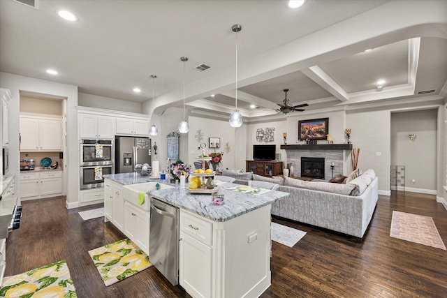 10874 Smoky Oak Trl, Flower Mound, TX 76226 - kitchen with appliances with stainless steel finishes, light stone countertops, recessed lighting, a kitchen island, and a ceiling fan