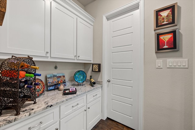 10874 Smoky Oak Trl, Flower Mound, TX 76226 - kitchen featuring white cabinetry, dark wood-style floors, and light stone counters