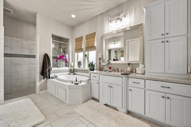 10874 Smoky Oak Trl, Flower Mound, TX 76226 - full bath featuring a tile shower, a bath, vanity, marble finish flooring, and recessed lighting